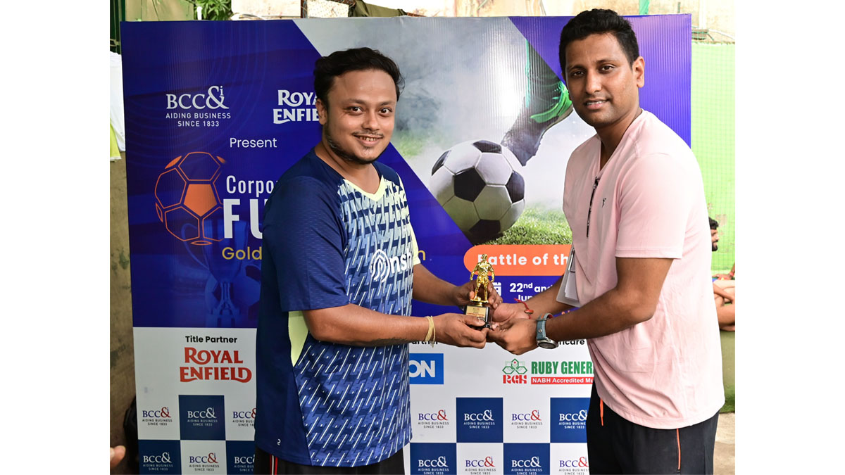 Mr. Bikramjit Saha, Sr. Executive, BCC&I handing over a Man of the Match Trophy