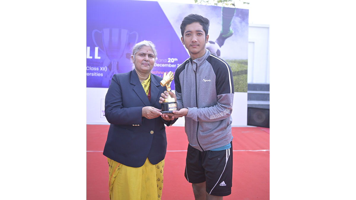 Ms. Mira Bhattacharya, Director Techno India Group World School handing over The Best Goalkeeper Trophy